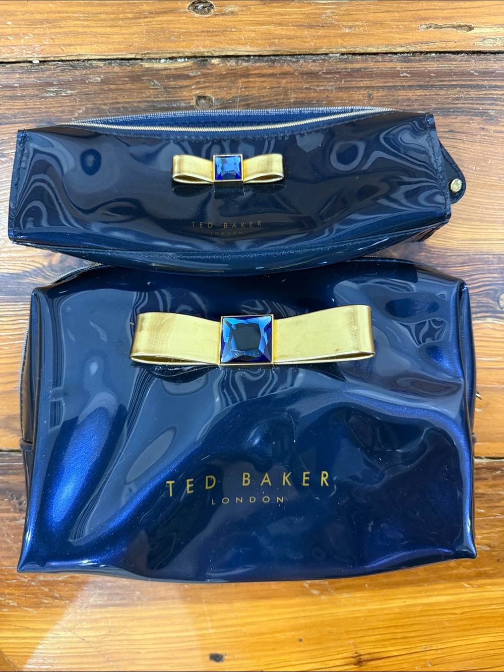 Ted Baker Navy Patent Cosmetic Pouch Set with Gold Bow and Blue Gem